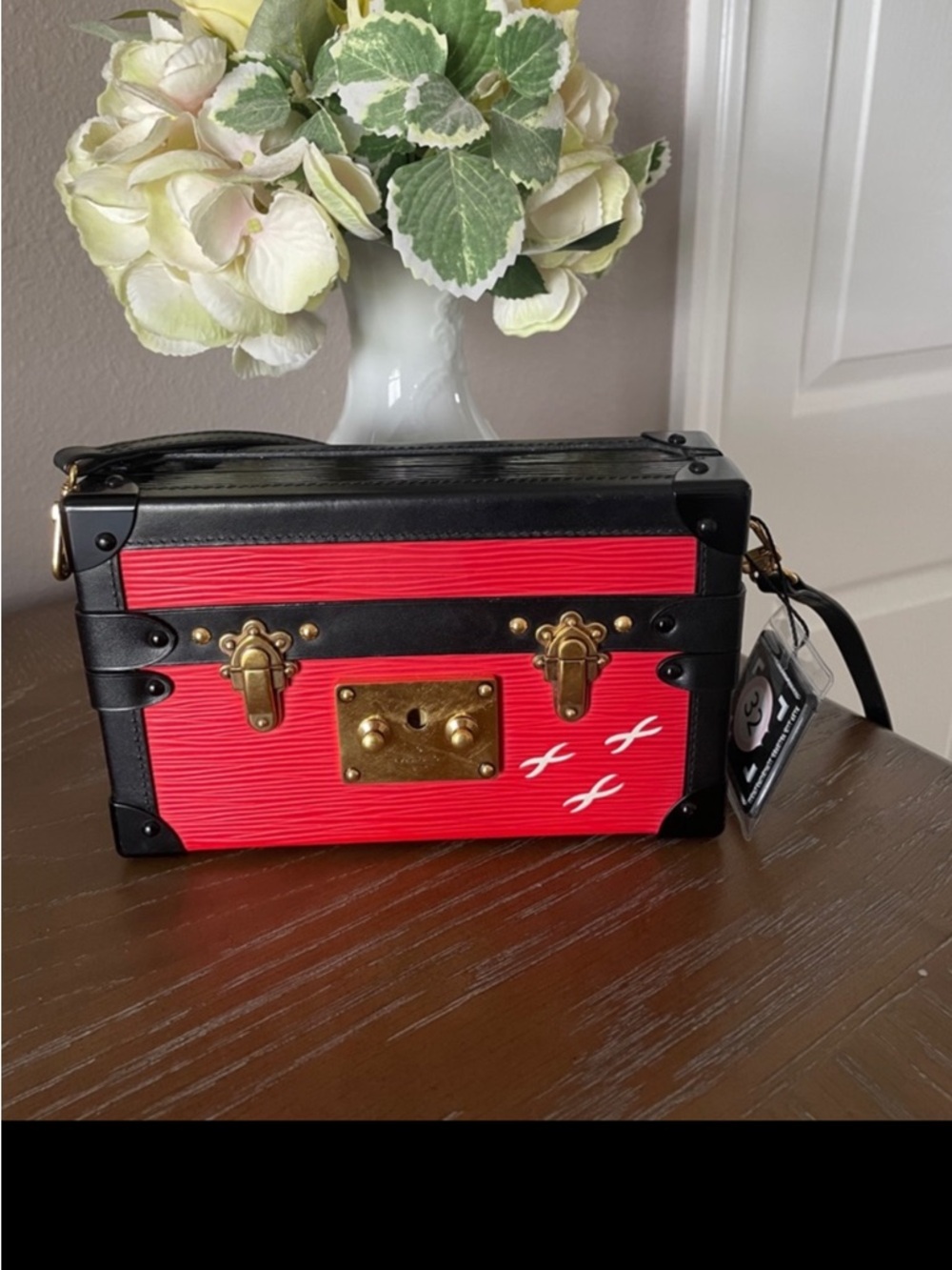 Louis Vuitton red and black Epi trunk bag with black trim and white bird motifs
